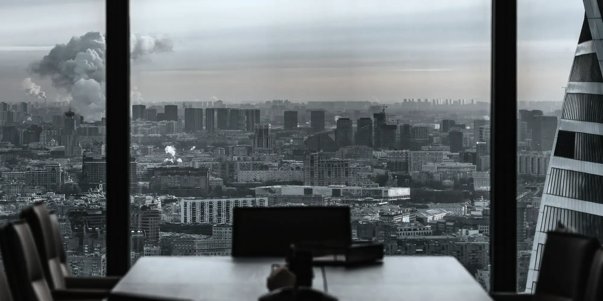 An empty meeting room looking out over the city